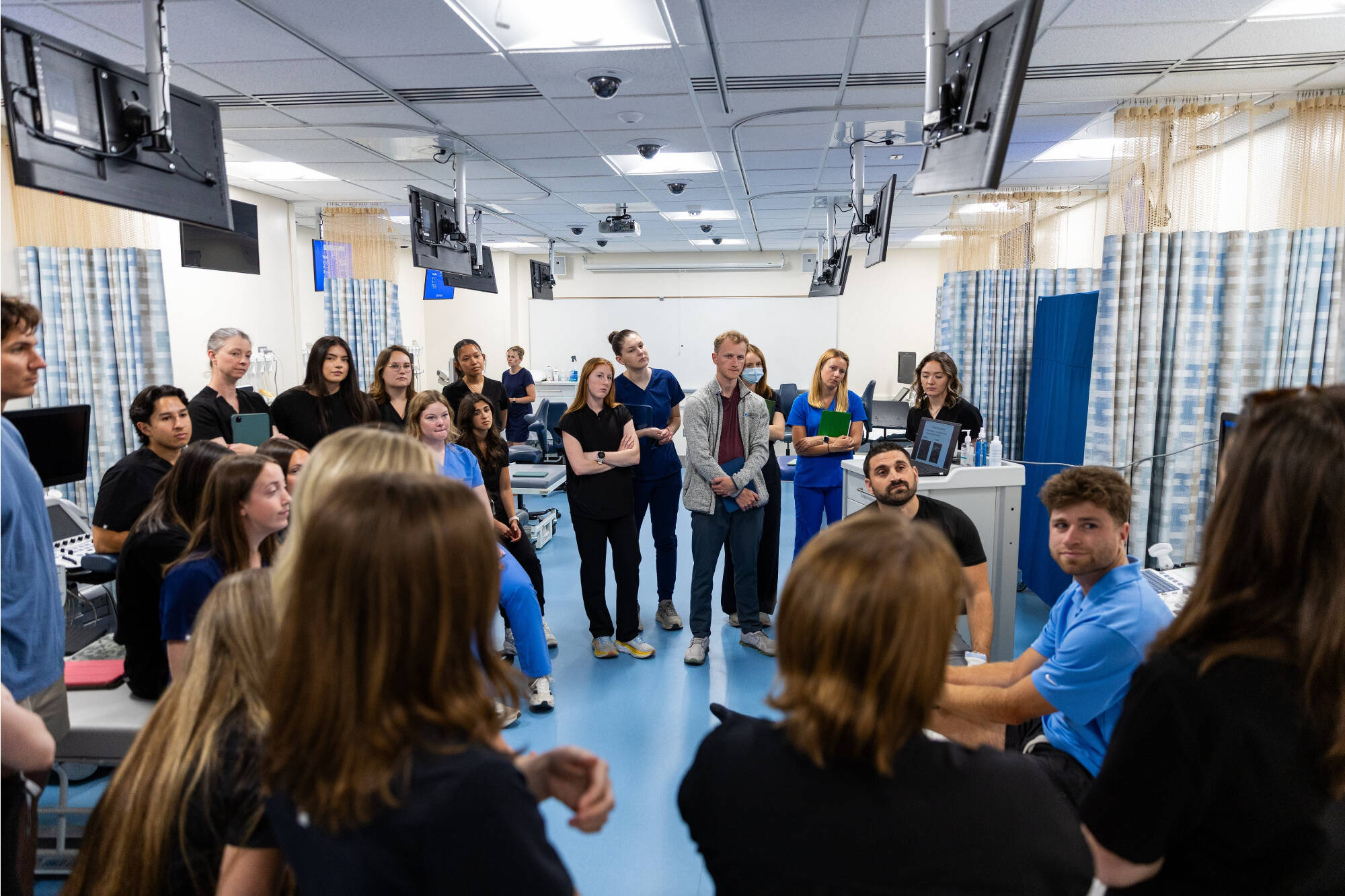 Students gather in a teaching lab setting